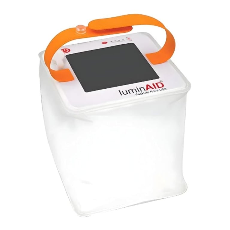 LuminAID portable inflatable solar-powered LED light with orange handle and white translucent body
