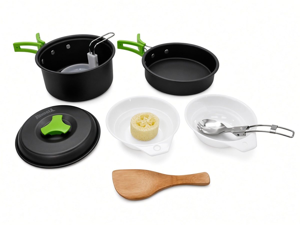 Kitchen kit for 2: black pot and pan with green handles, lid, two white bowls, cutlery, and a wooden spatula