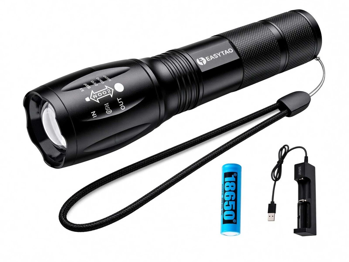Black rechargeable handheld flashlight with adjustable zoom, wrist strap, 18650 battery, and charging base